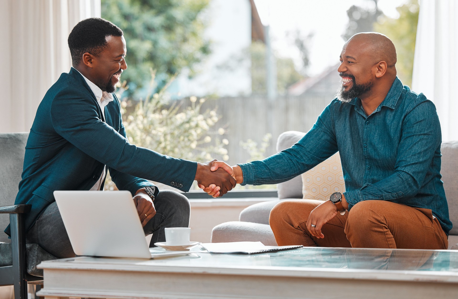 Shot of two businessmen shaking hands in agreement